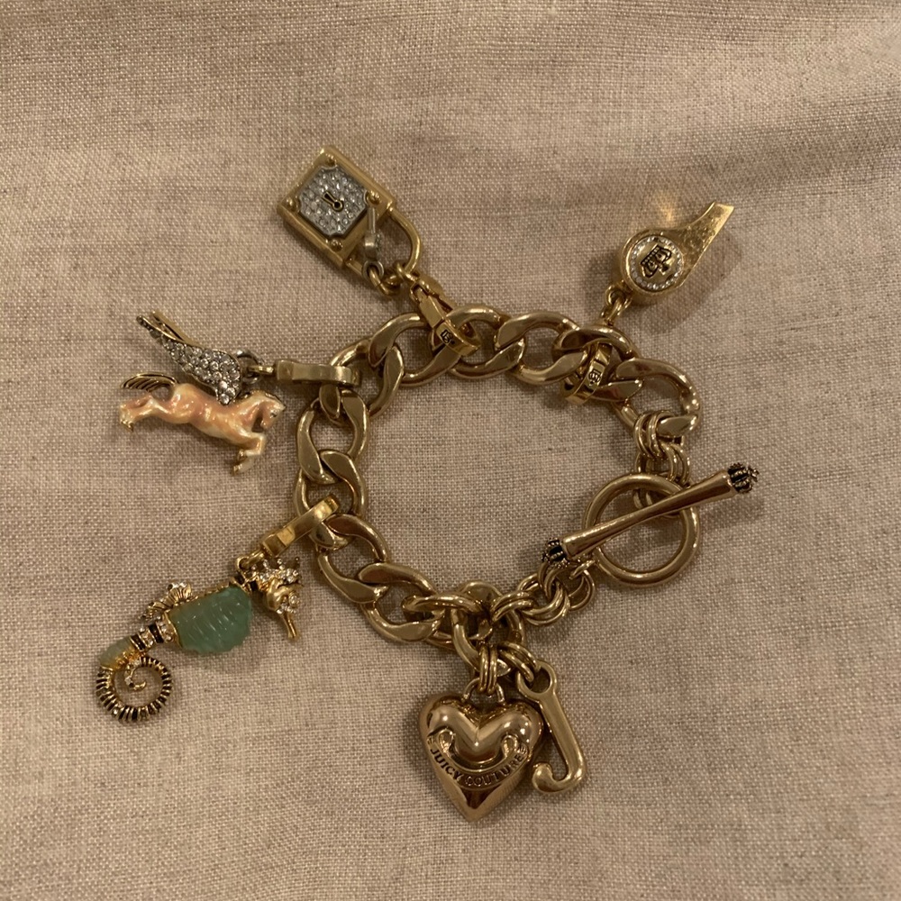 Juicy Couture gold charm bracelet with charms